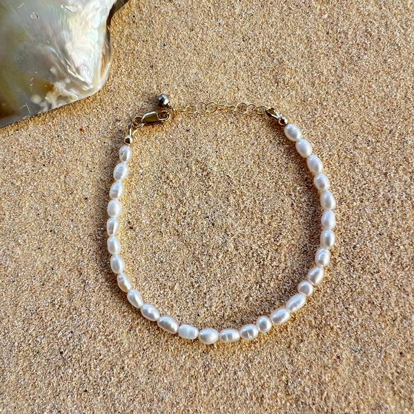 Single strand white, rice freshwater pearl bracelet with 1" adjustable chain